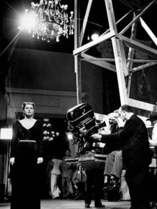 Hitchcock preps for a scene with Ingrid Bergman in his 1946 film Notorious